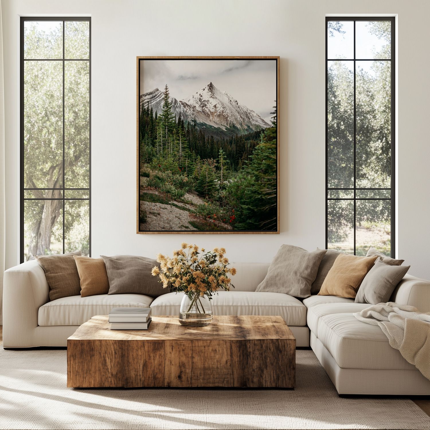 Modern living room with white sectional sofa, wooden coffee table, and landscape artwork against cream walls.