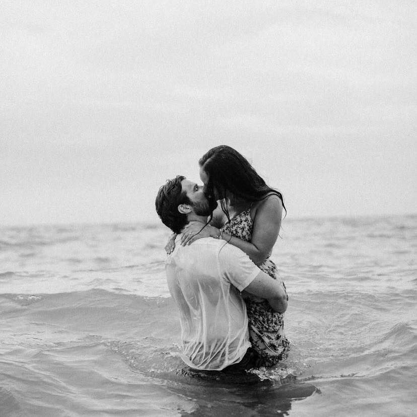 engagement session, two people kissing in the water of lake huron