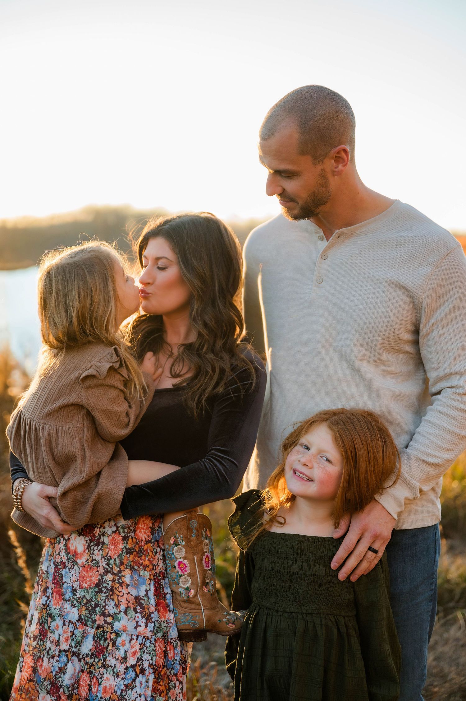 Tender family moments captured during golden hour in nature.