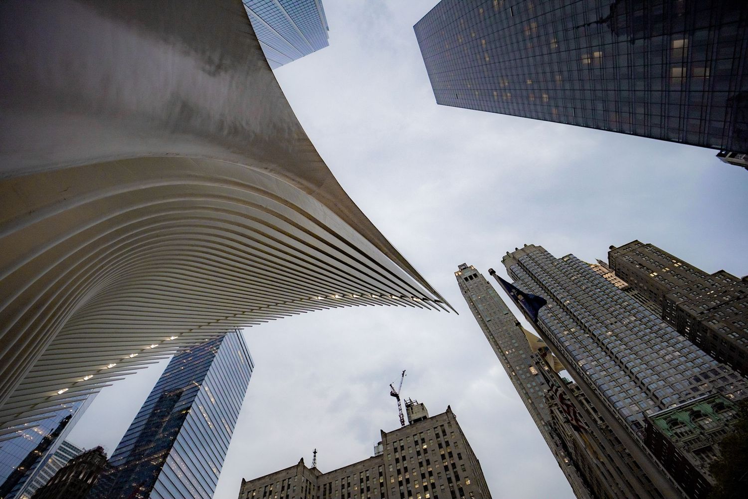 Low angle view of the Oculus and skyscrapers in Lower Manhattan, New York City.