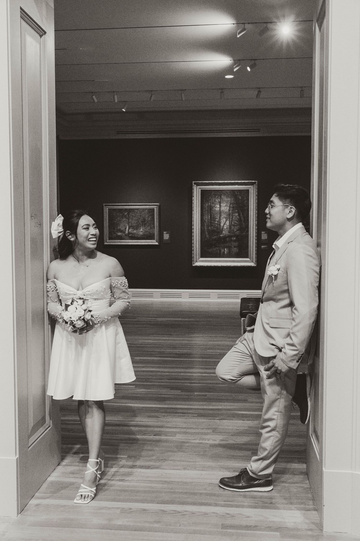 A bride and groom embrace and look at each other lovingly on their wedding day.