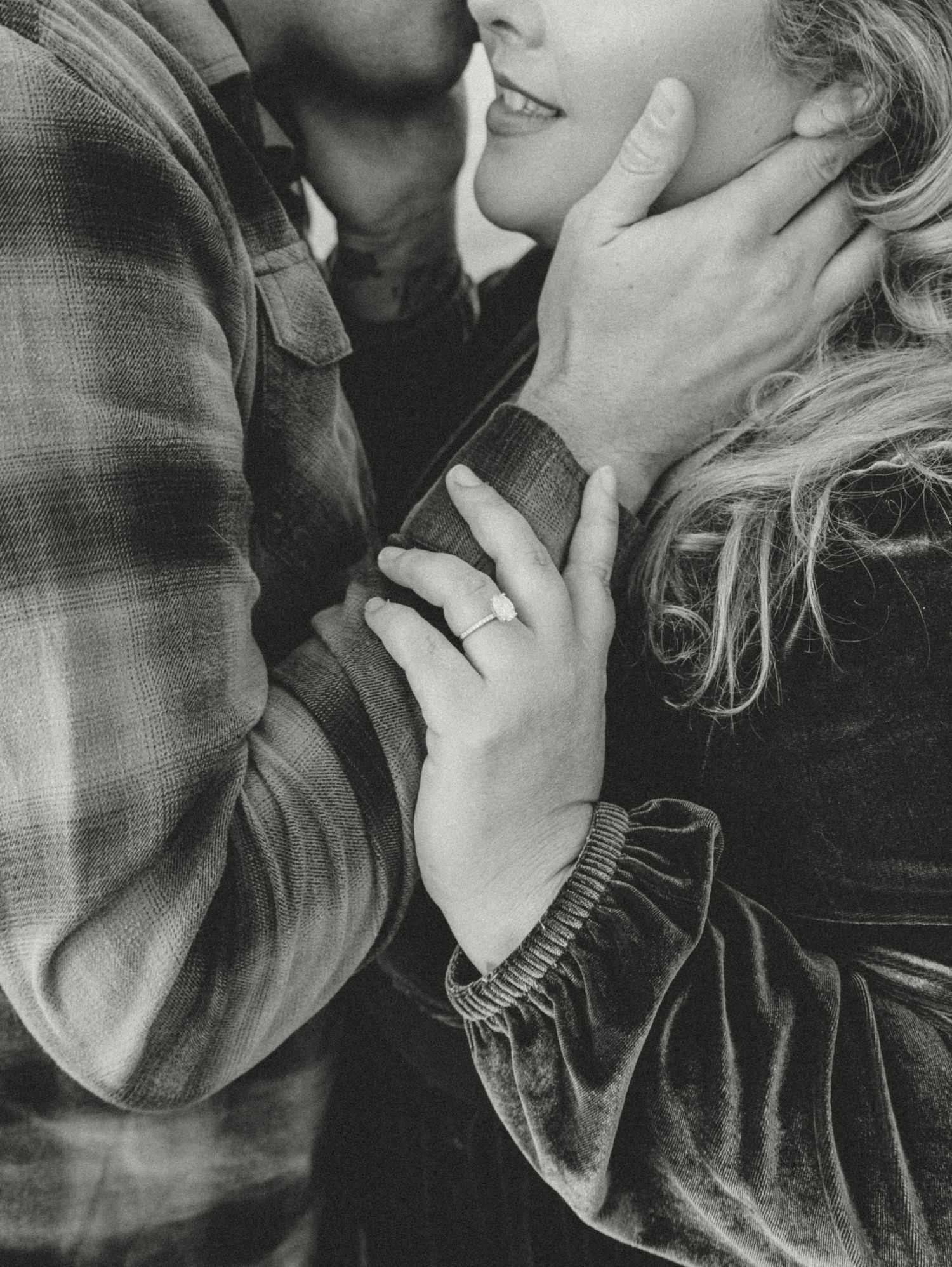 Intimate black and white close-up portrait showing tender moments.