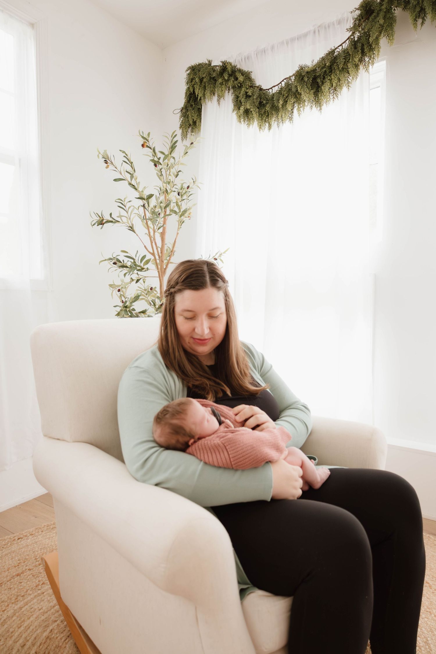 Cozy indoor lifestyle photos showing quiet moments on a white armchair with natural window light.