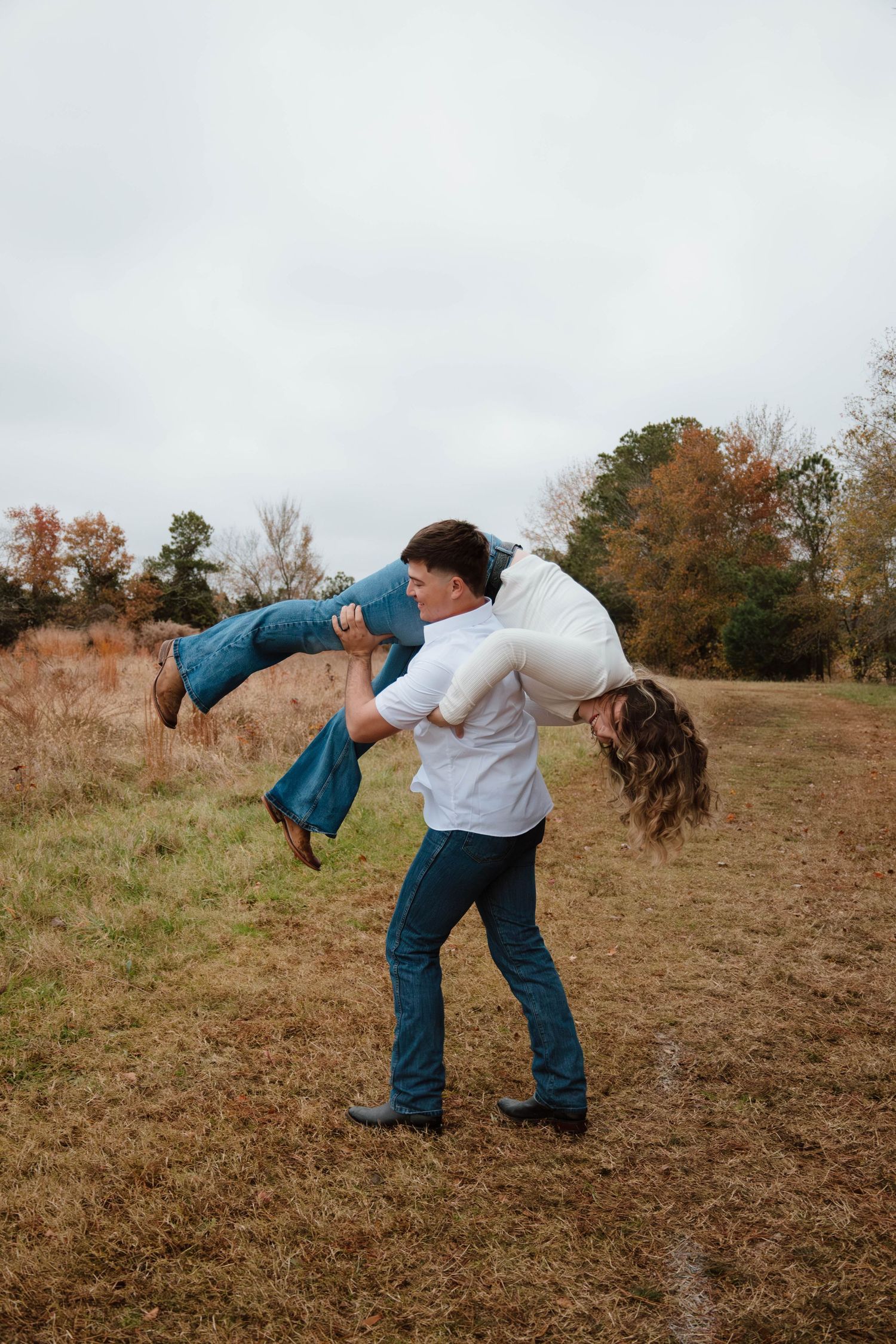 Playful sequence showing a dip dance move in an autumn field.