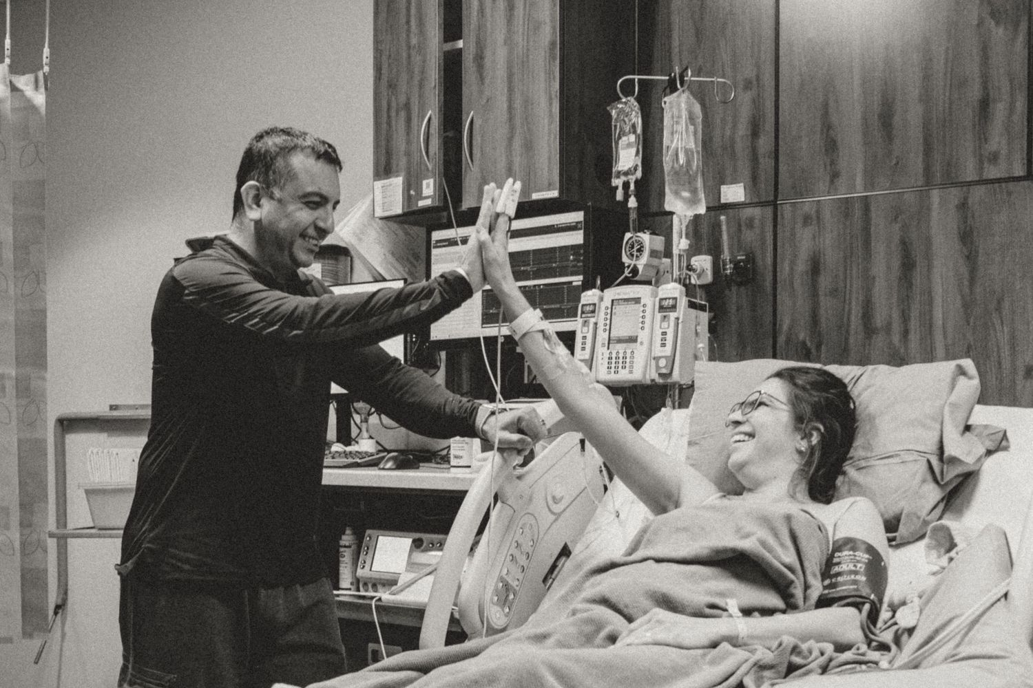Sequential images showing medical care being provided in a hospital delivery room.