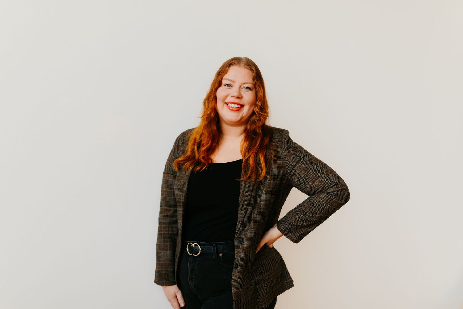 Professional headshots against white background showing different expressions.