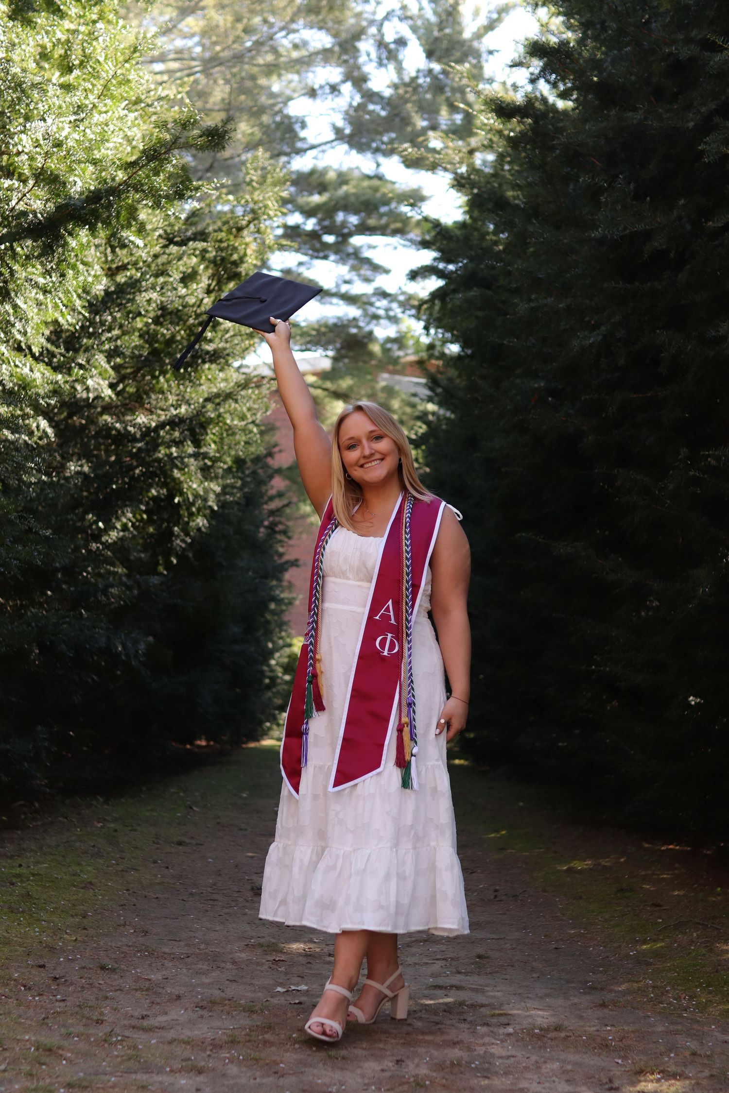 College senior photo, graduation photo, natural light photography, WPI. Worcester, MA. Cap in the air.