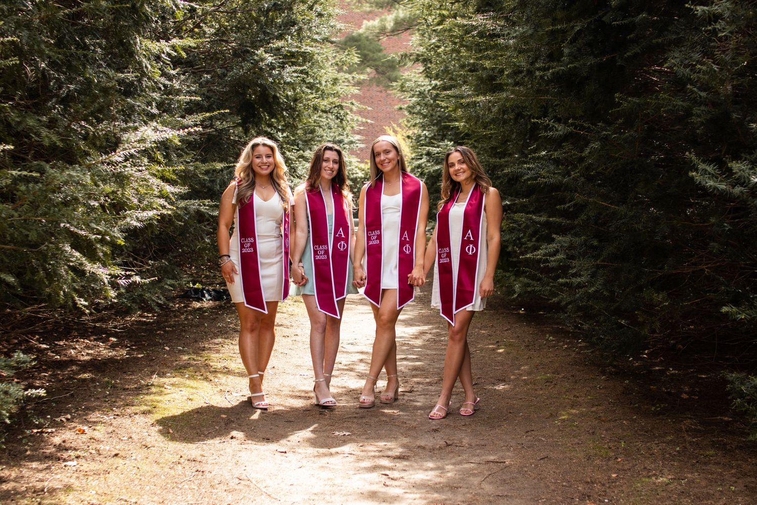 College friends graduation photos, natural lighting photography, WPI, sorority, senior grad photos. Worcester, MA. Walking towards camera.