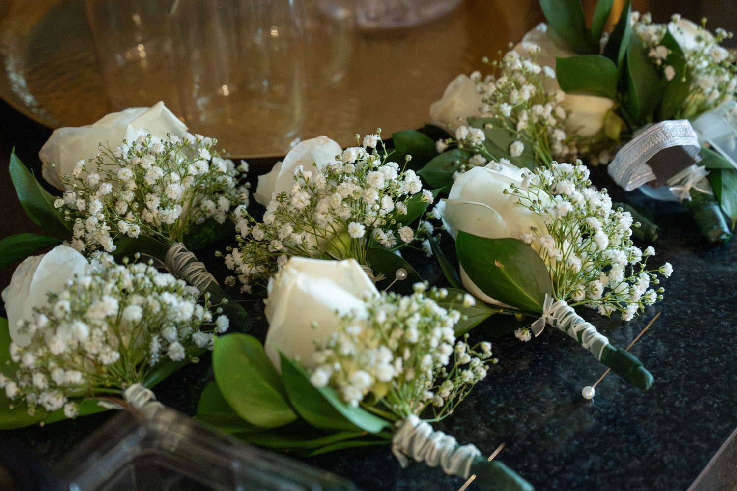 Close up of white rose boutonnières