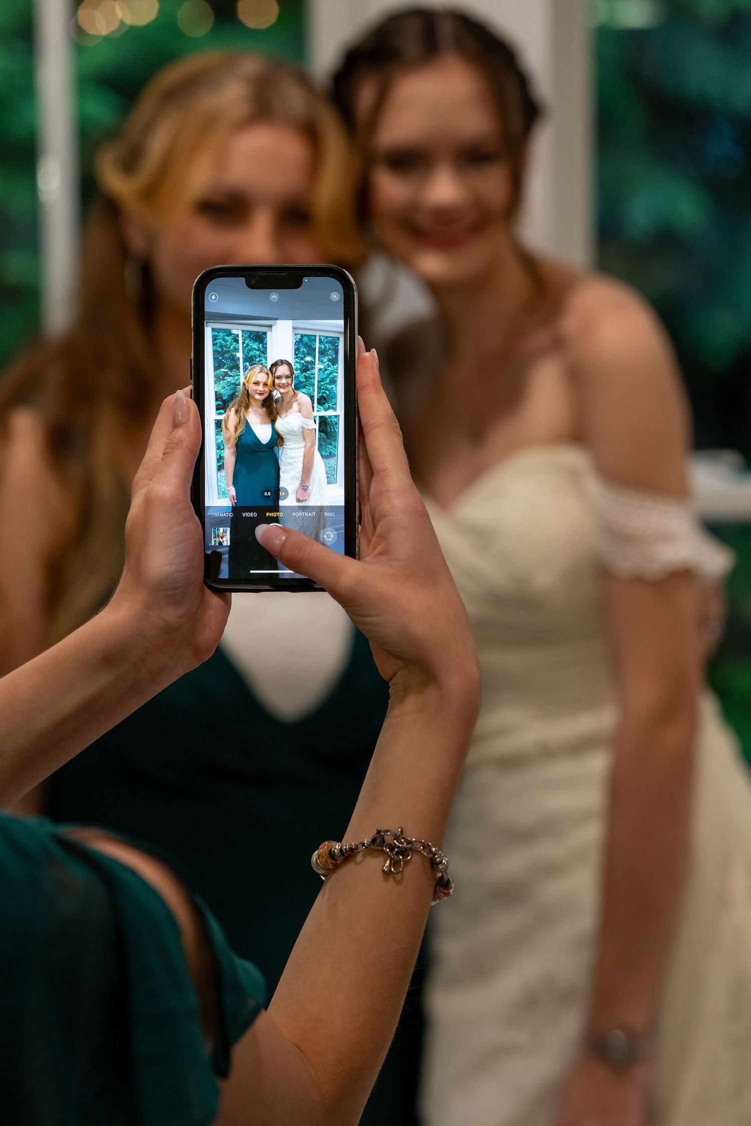 Bride and Bridesmaid Cell phone photo taken by other bridesmaid
