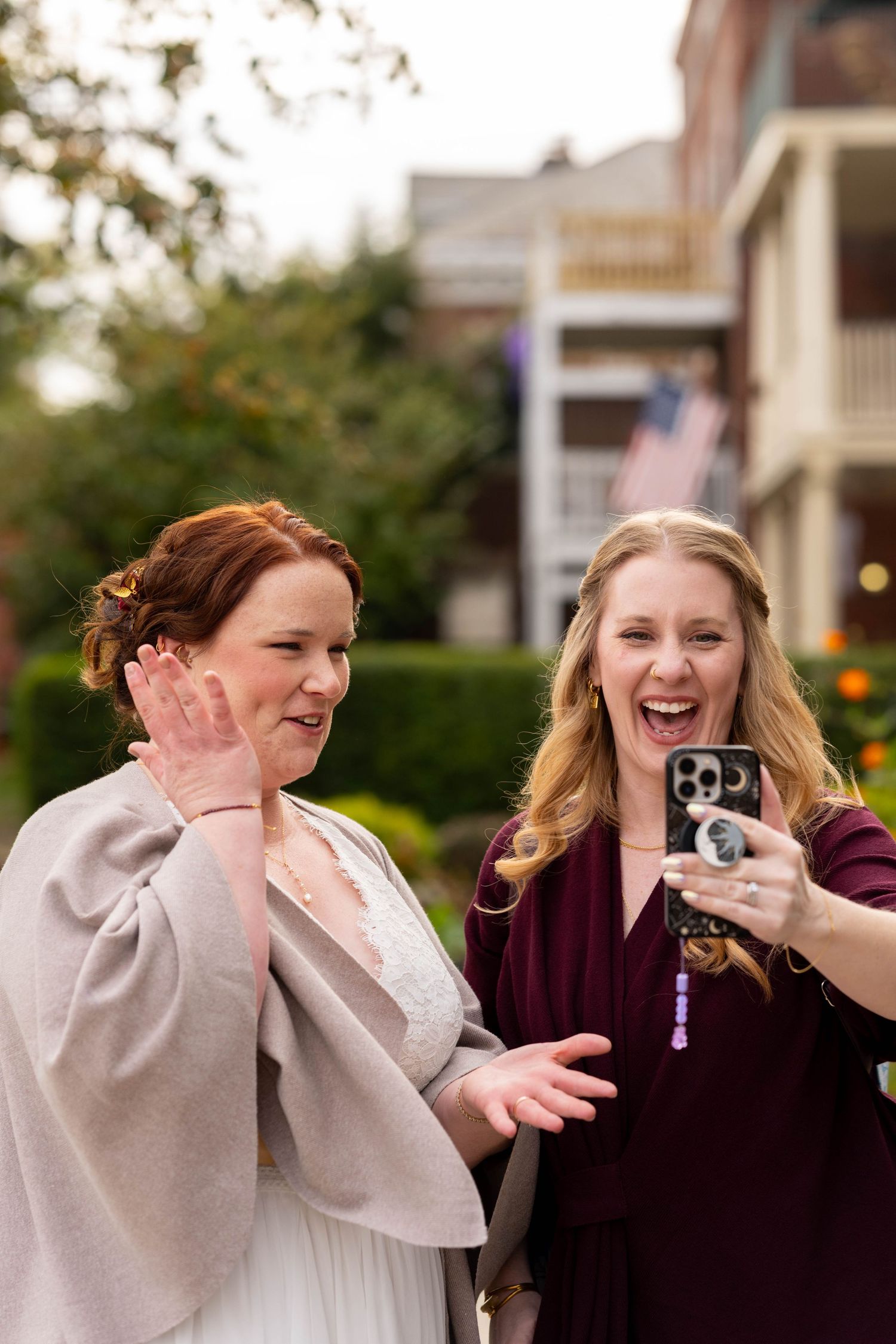 Bride and Bridesmaid FaceTiming during the walk to the reception Richmond Virginia