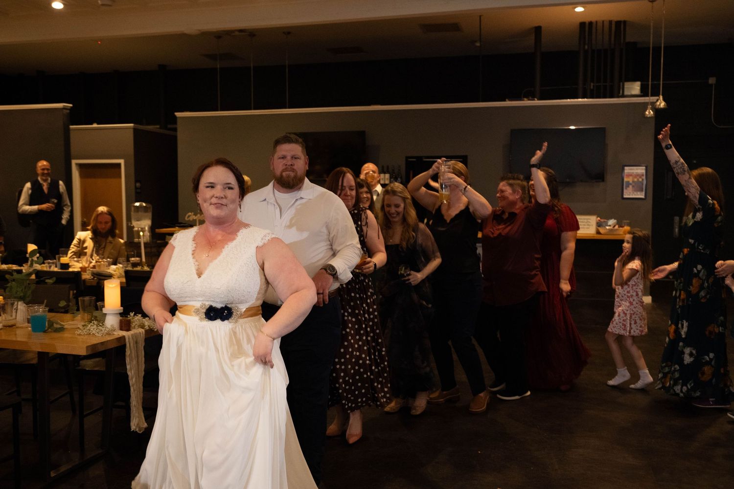 Bride leading conga line during reception at Three Notch'd Brewery Richmond Virginia