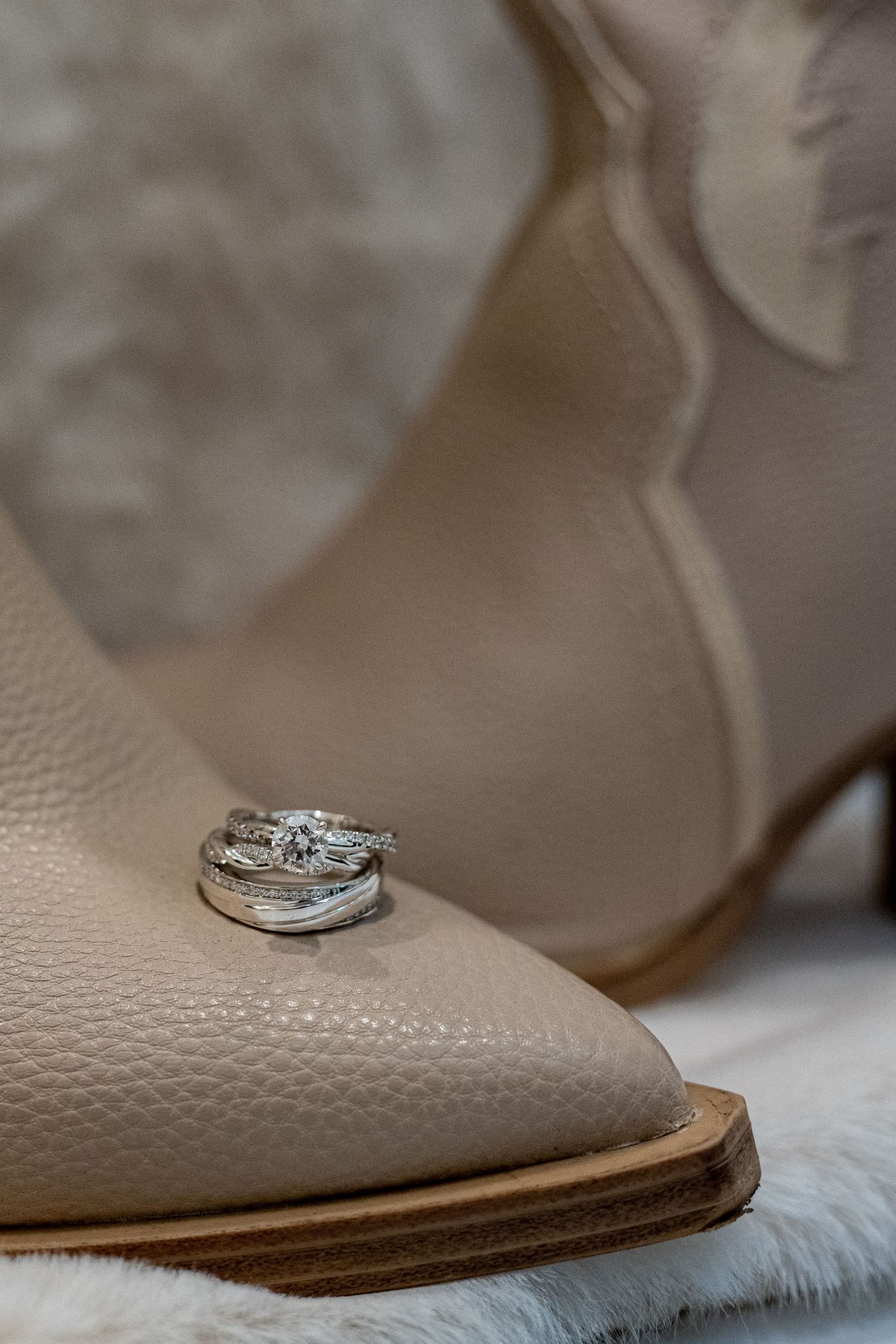 cowboy boots with wedding rings on toe