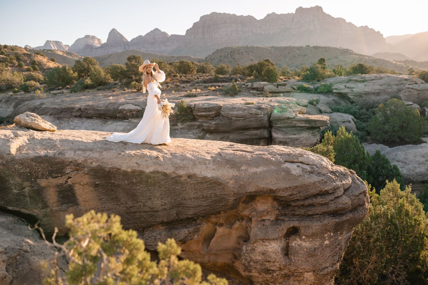Ethereal desert sunrise bridal photoshoot captured by a Utah elopement photographer