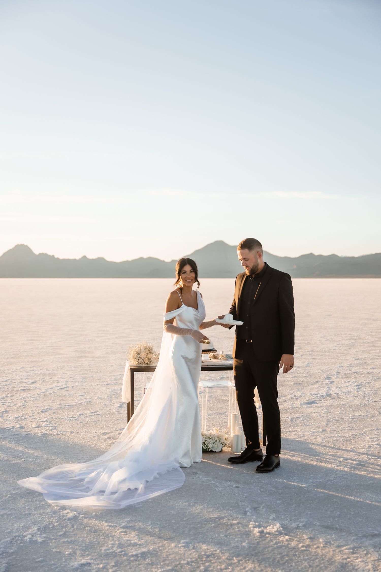 Wedding couple exchanges vows at intimate ceremony on salt flats.