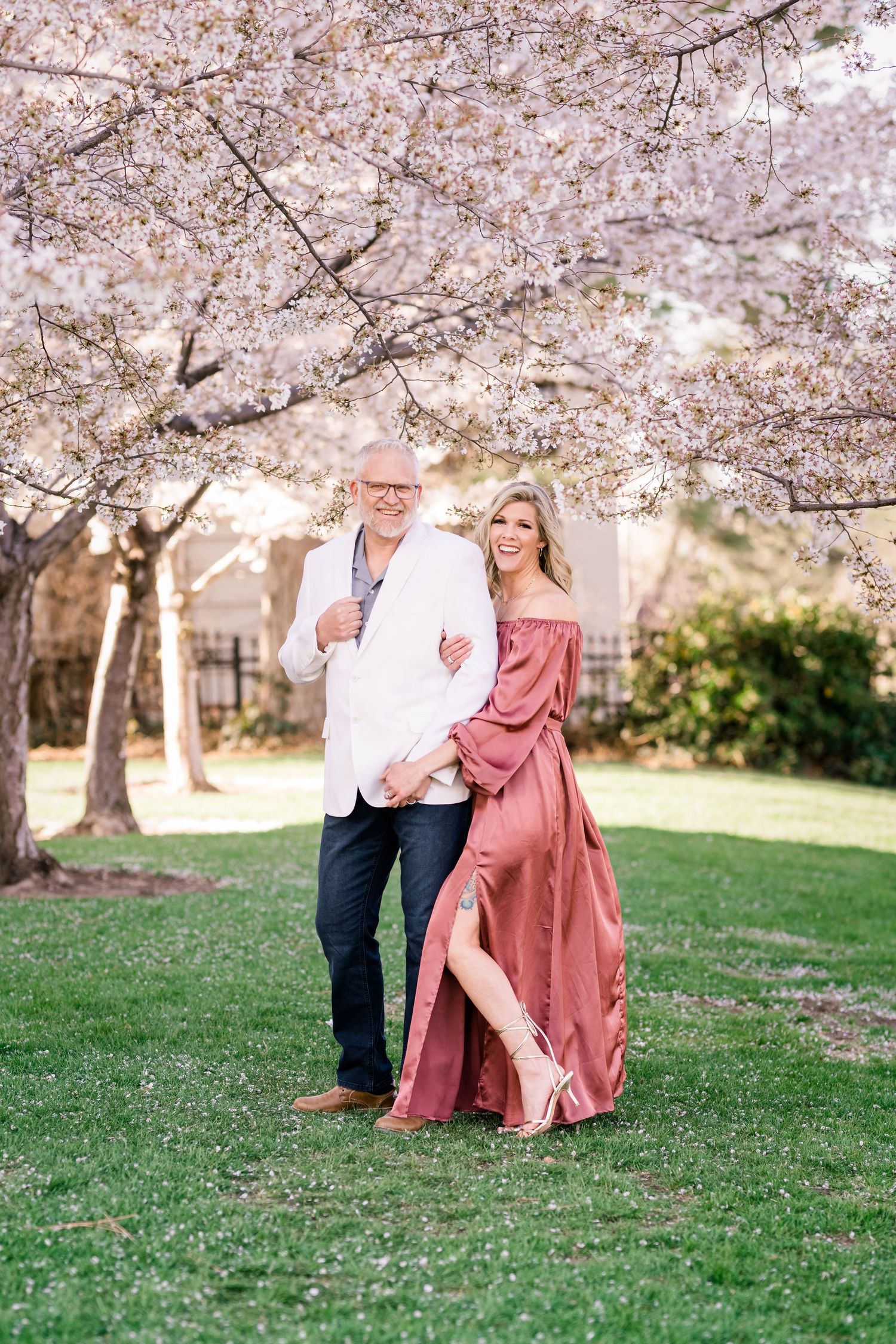 Engaged couple laugh and smile at the Utah State Capitol by Utah engagement photographer Coley Cook