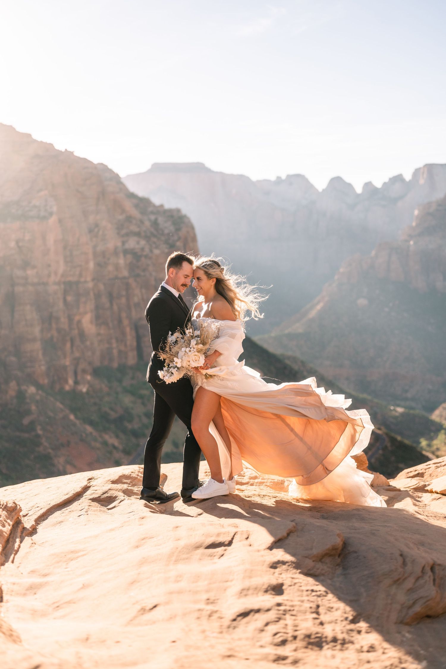 Wedding portraits at the Zion Overlook at sunset by Utah Elopement Photographer