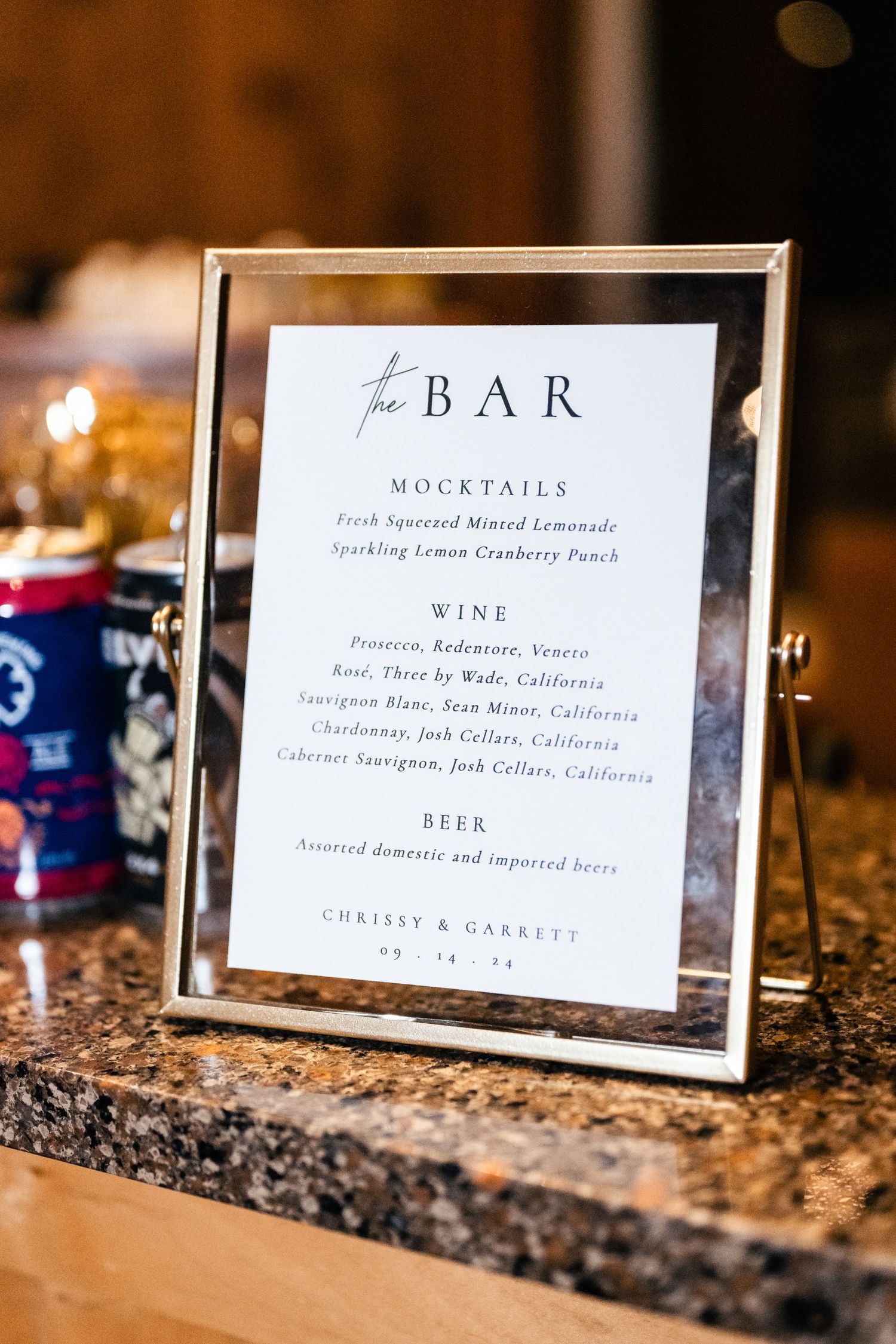 Bar menu in silver frame listing mocktails, wine and beer selections for a wedding reception. Park City Wedding Photographer. Utah Wedding.