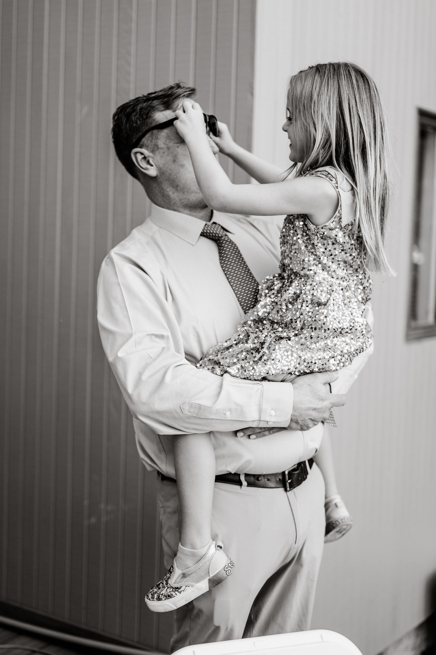 Black and white photos capturing tender moments between wedding guests.