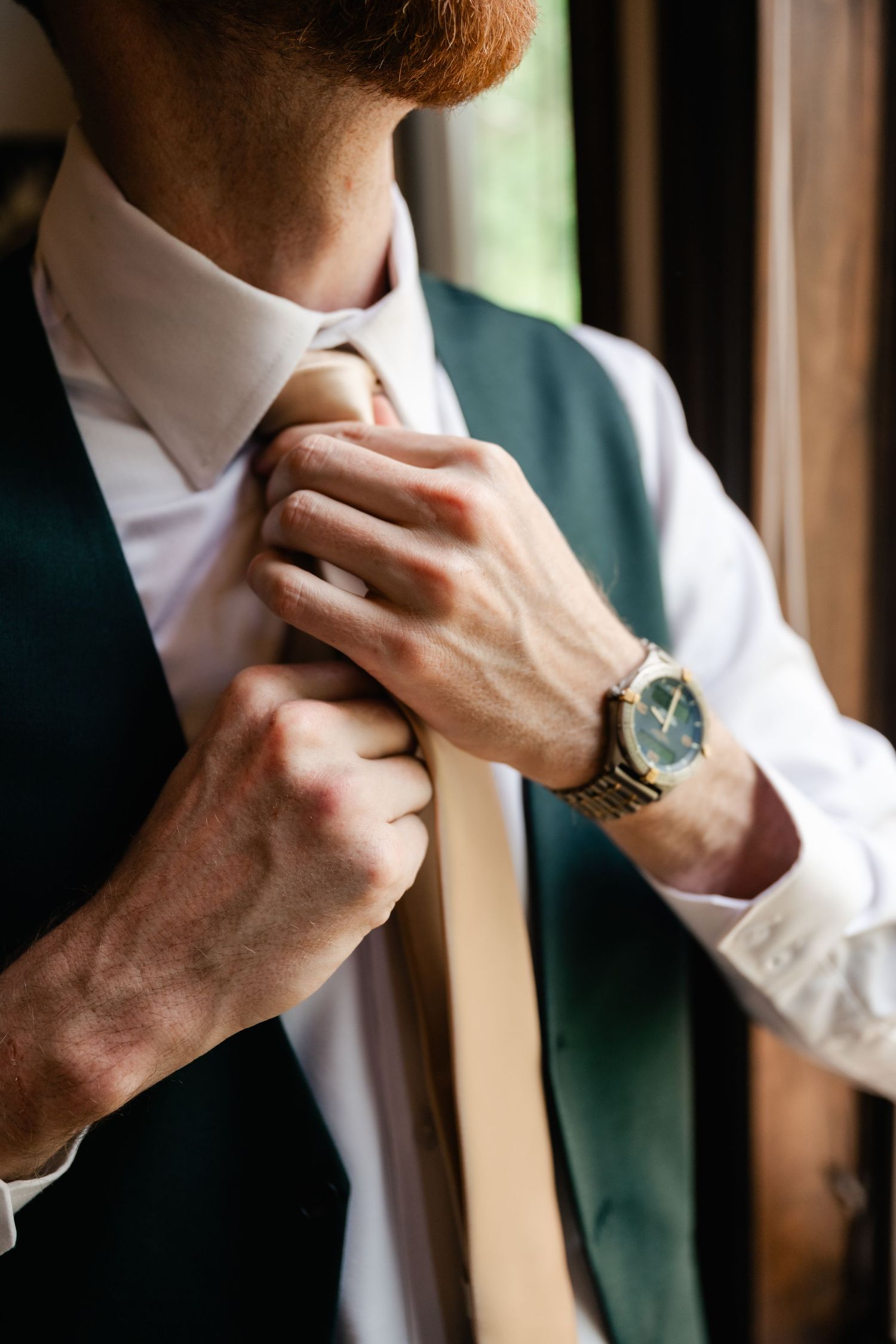 Close-up sequence of hands adjusting a formal shirt collar and tie with elegant watch visible.