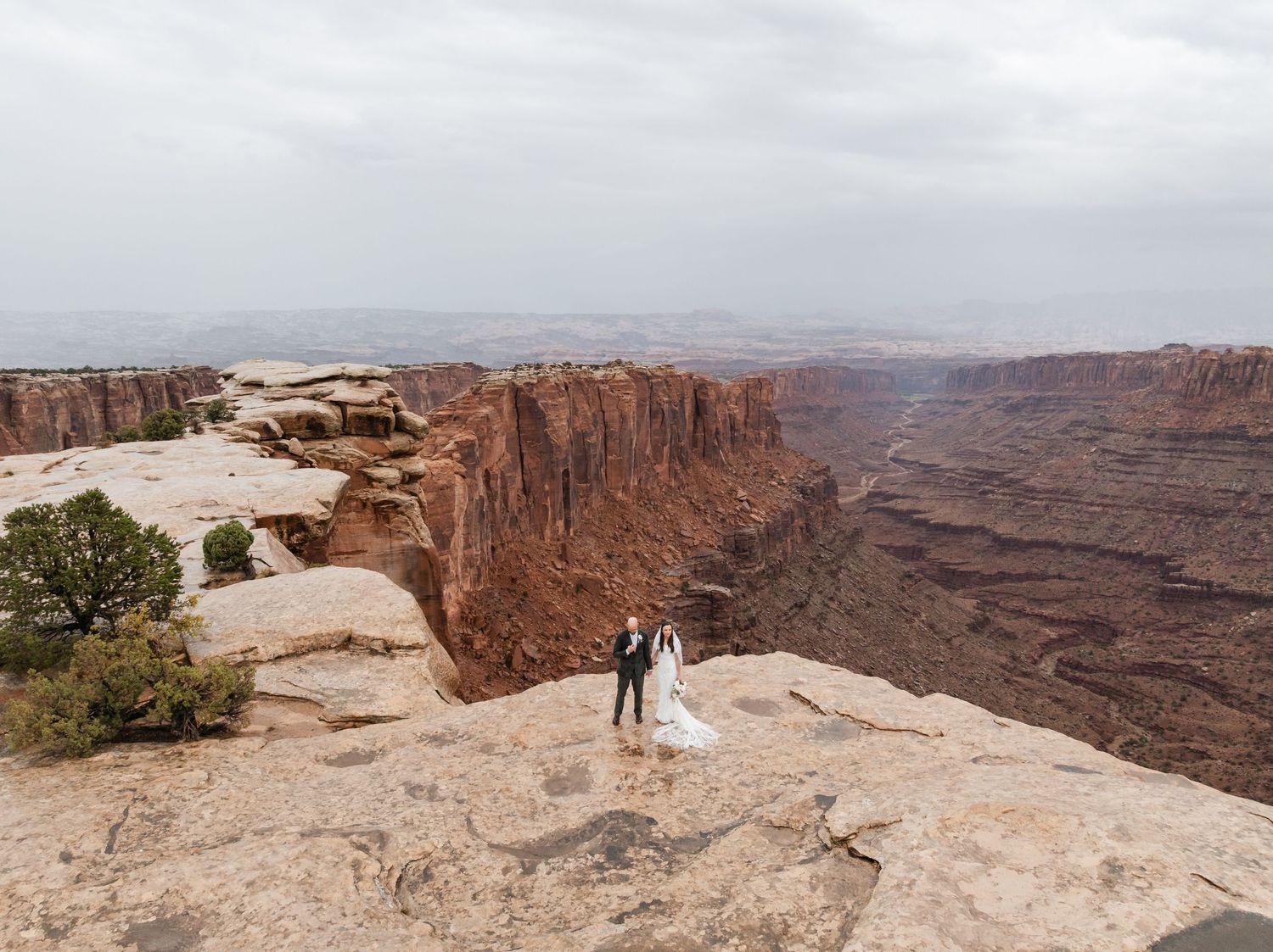 Scenic overlook of vast desert canyons with red rock formations stretching to the horizon at Dead Horse Point State Park.
