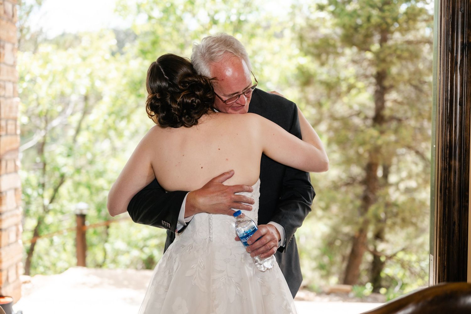 Emotional wedding moments captured between two people in an outdoor setting.