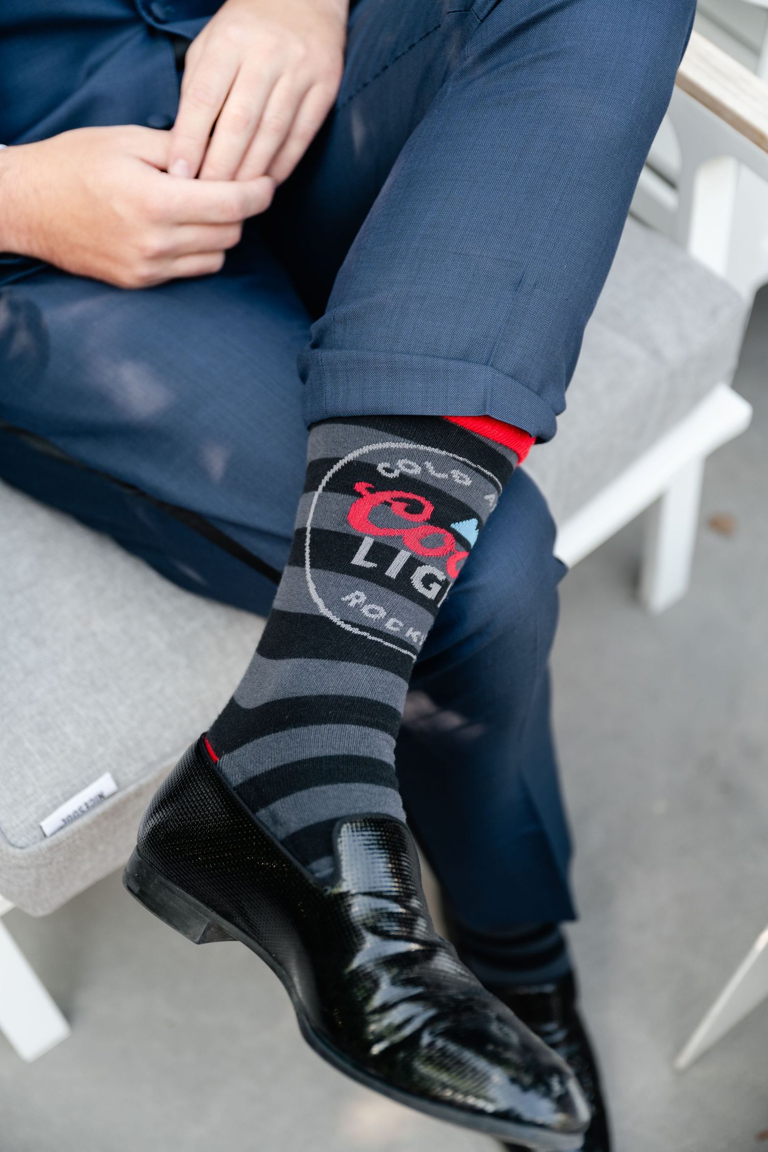 Close-up of formal dress socks and shoes showing fun pattern details.