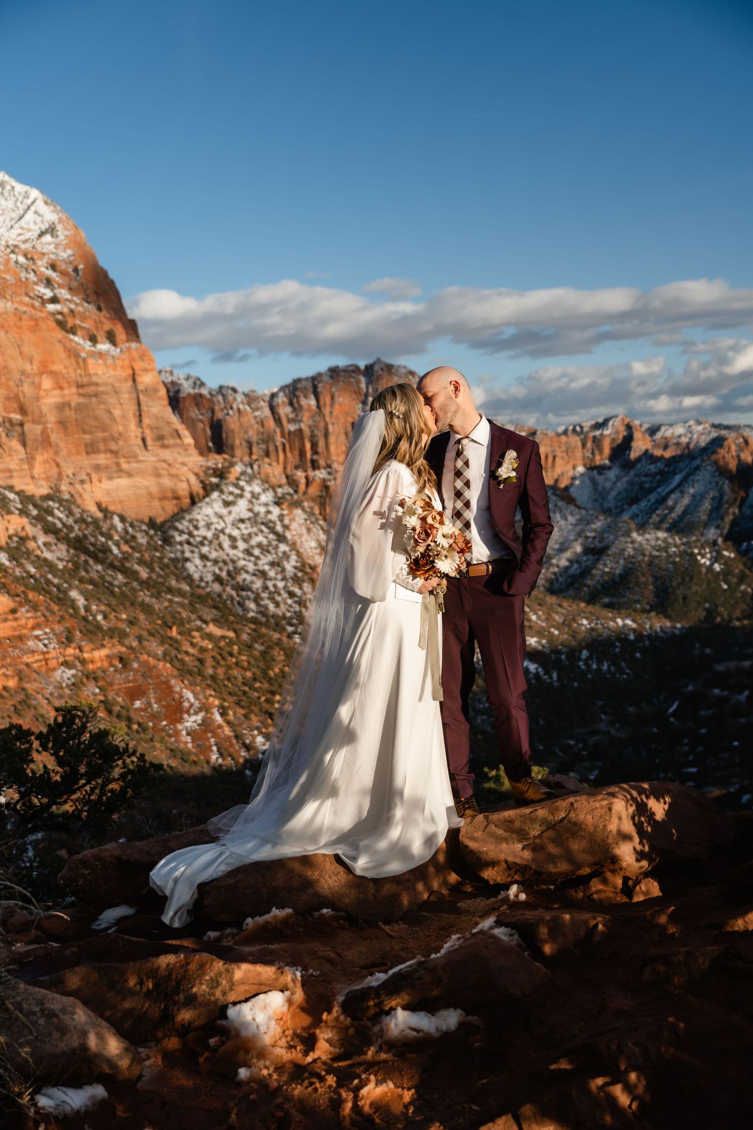 Wedding photography at scenic mountain overlook with dramatic canyon views.