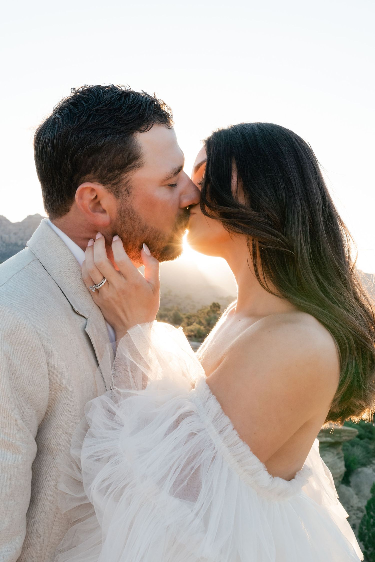 Zion Adventure Session. Intimate sunset wedding portrait with desert mountains in background. Utah photographer.