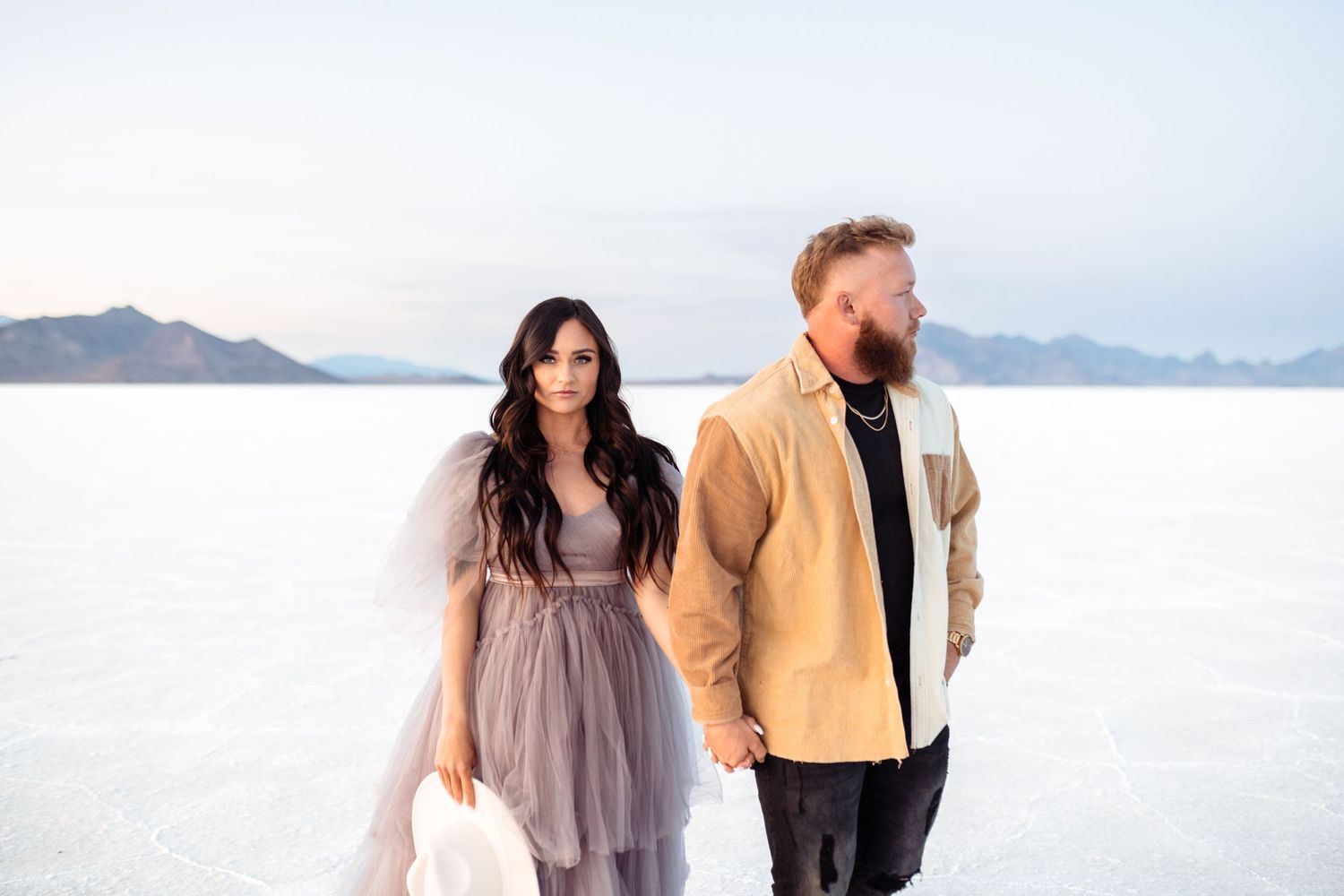 Couple hold each other during Salt Flats photos by Utah couples photographer during sunset