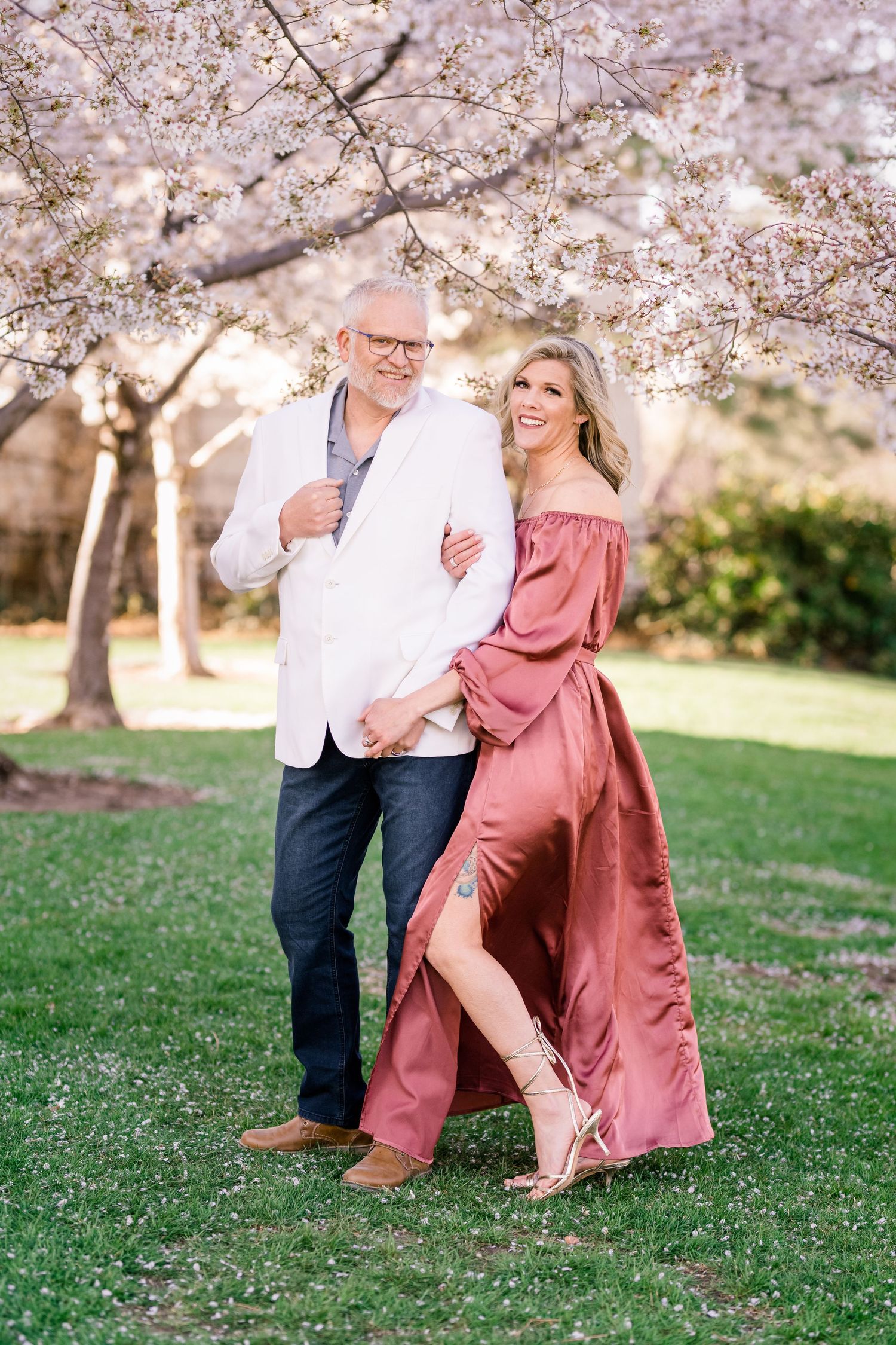 Engaged couple laugh and smile at the Utah State Capitol by Utah engagement photographer Coley Cook