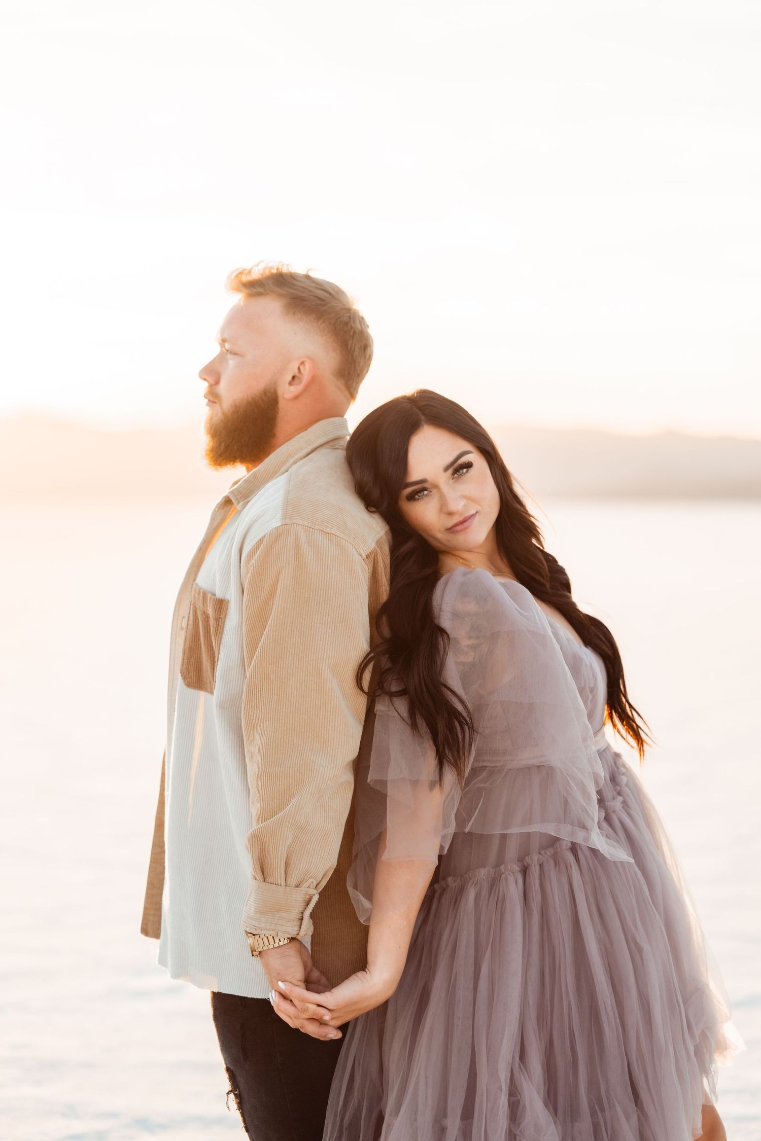 Salt Flats photos of a couple during sunset by Utah engagements photographer