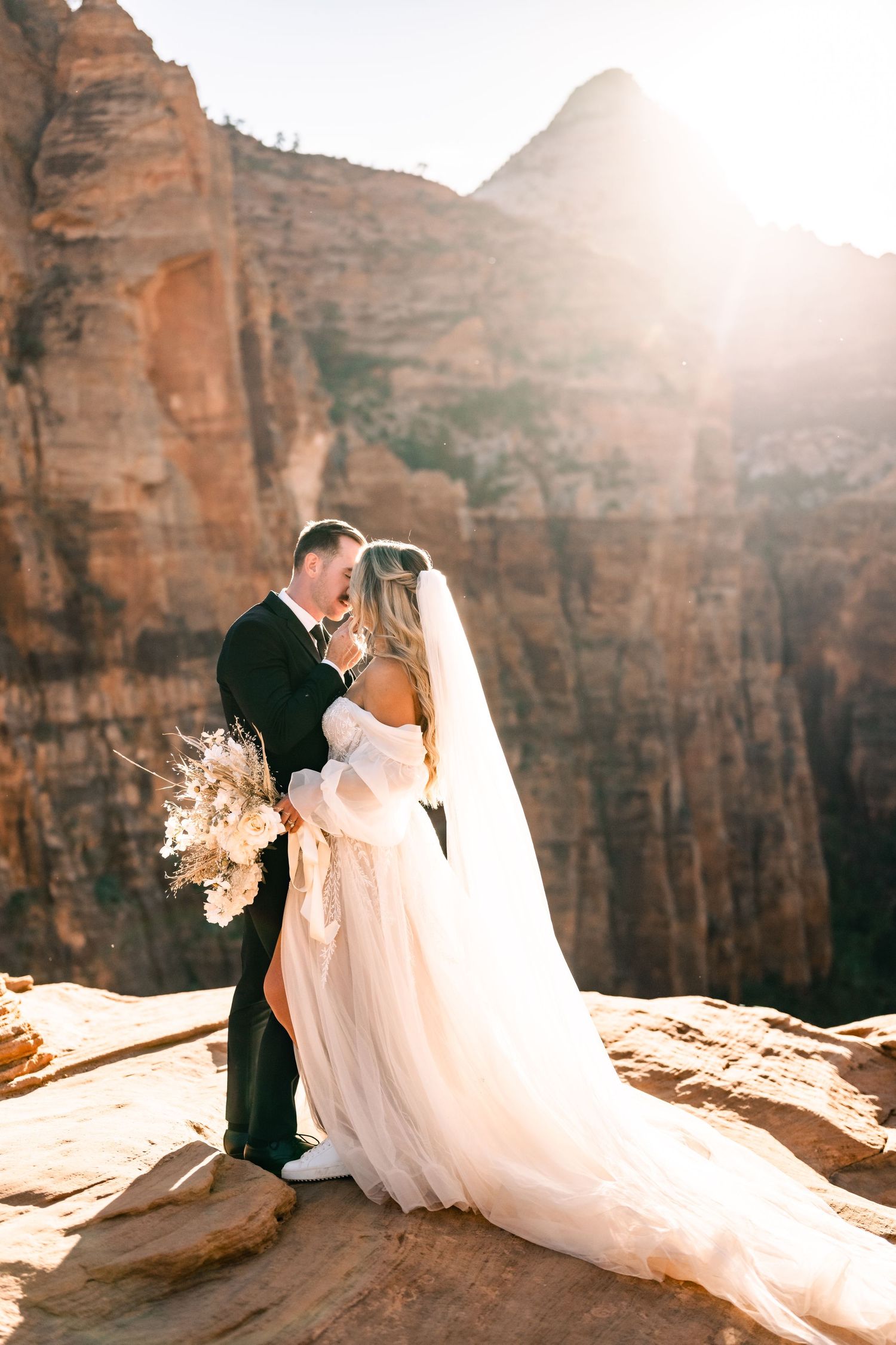 Wedding portraits at the Zion Overlook at sunset by Utah Elopement Photographer