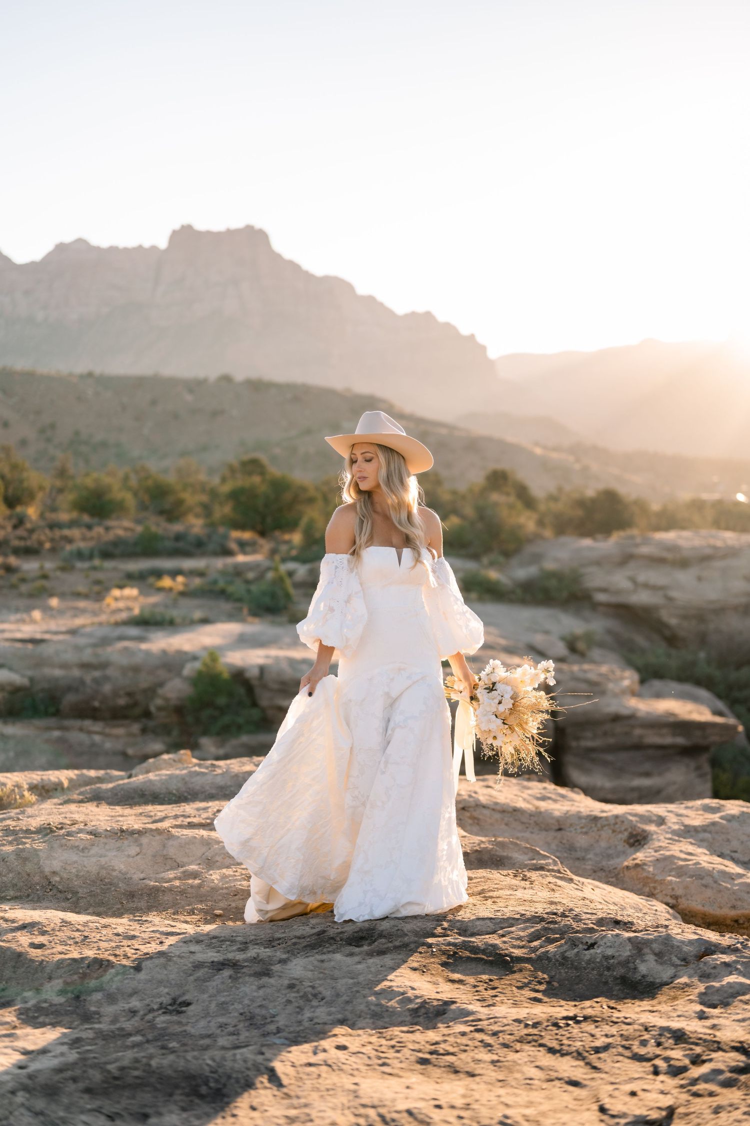 Ethereal desert sunrise bridal photoshoot captured by a Utah elopement photographer