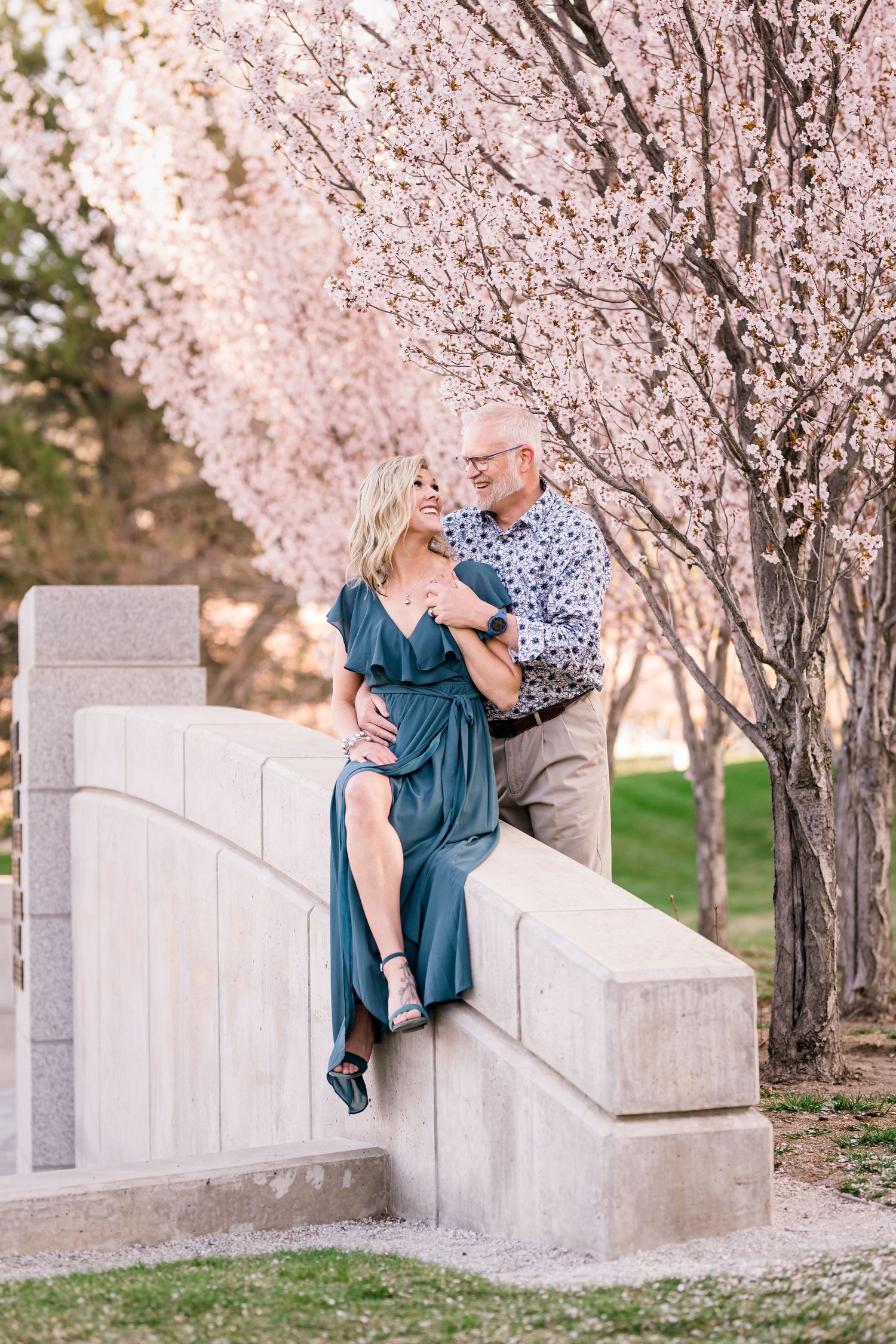 Engaged couple laugh and smile at the Utah State Capitol by Utah engagement photographer Coley Cook