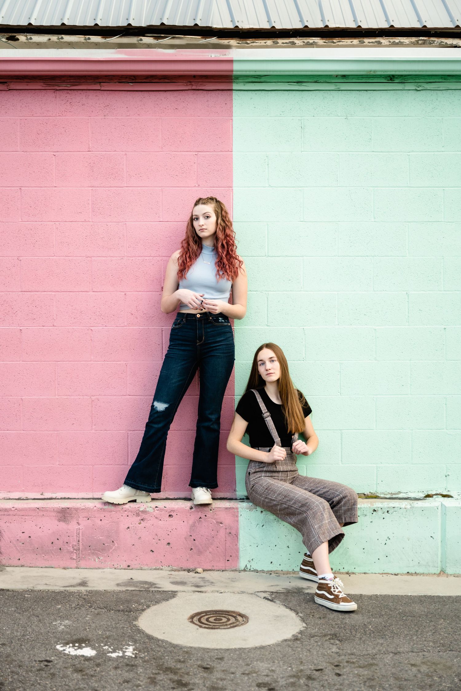 Creative fashion photos showing different poses against a pink and mint colored wall with casual street style outfits.