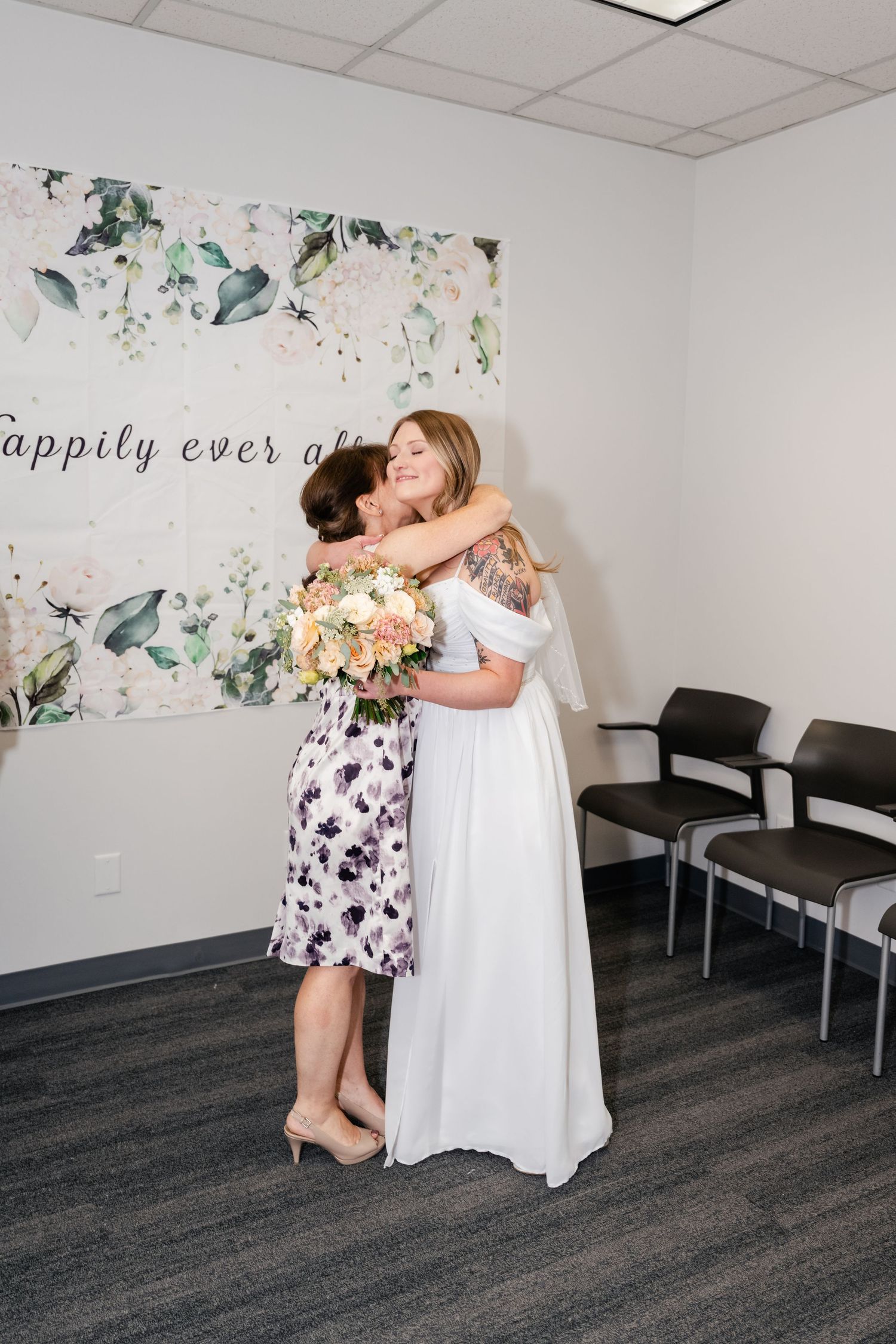 A touching moment captured in a room with floral wallpaper and 'happily ever after' text visible.