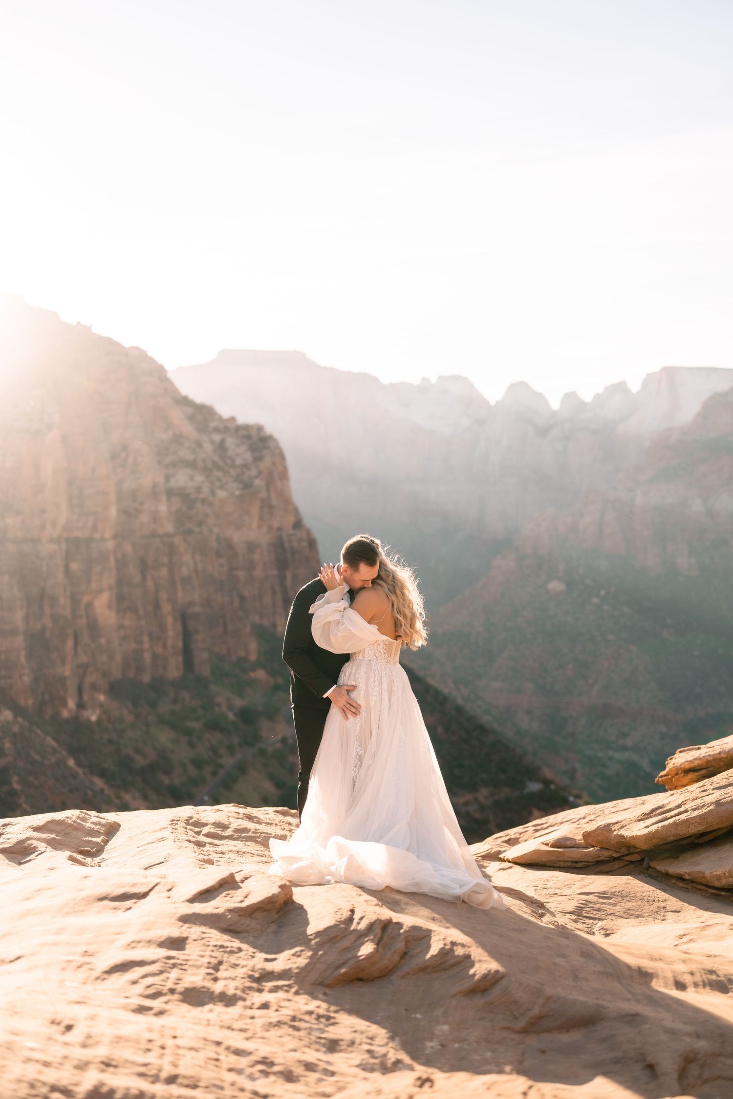 Wedding portraits at the Zion Overlook at sunset by Utah Elopement Photographer