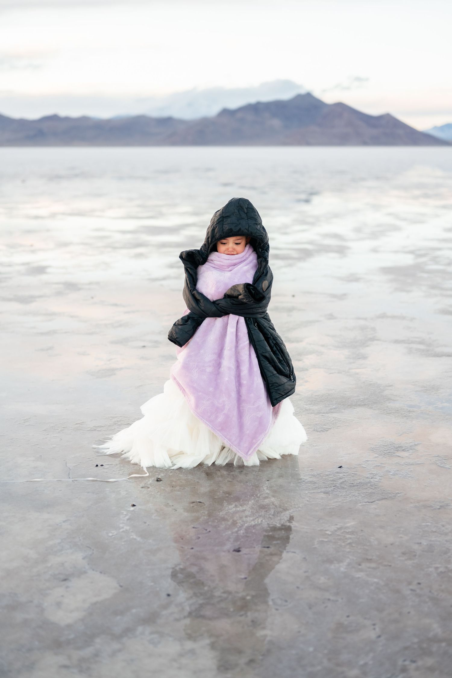 Young girl bundled against the cold of the Salt Flats.