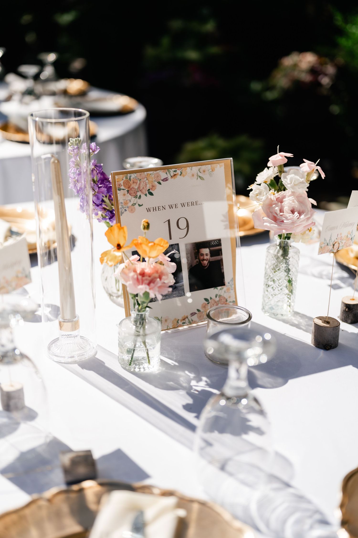 Elegant wedding reception table setting with delicate floral centerpieces and place cards in natural lighting. Park City Wedding.