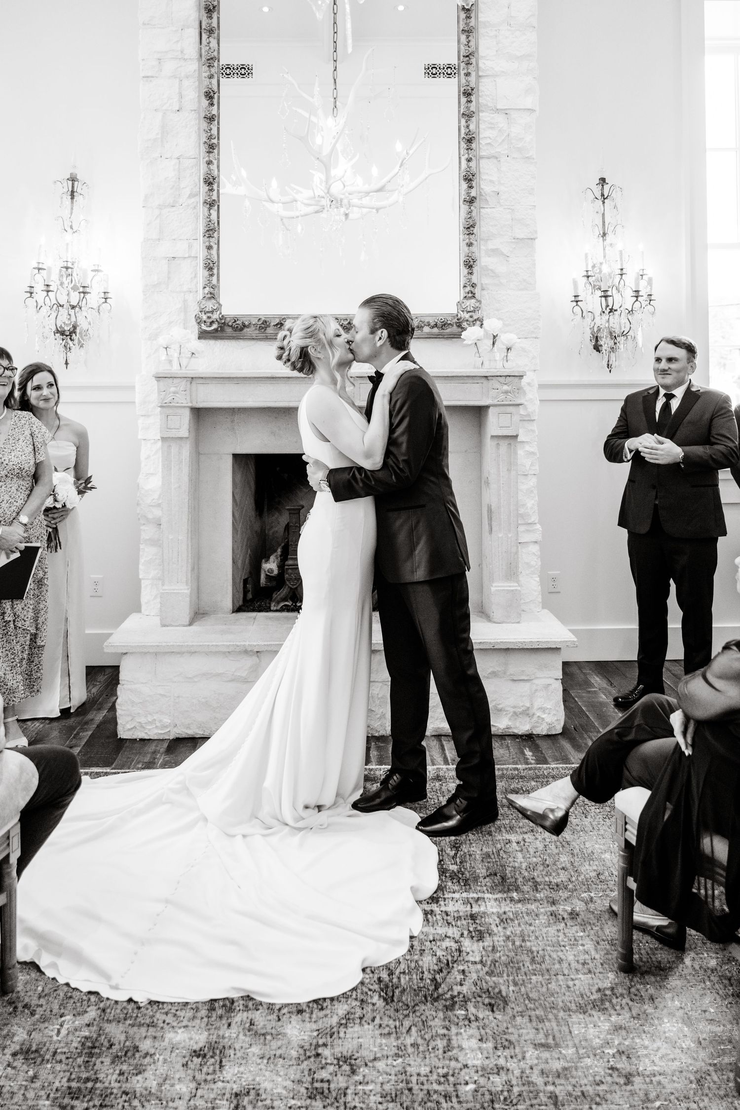 Black and white photo series showing a romantic first dance sequence at an elegant wedding reception.