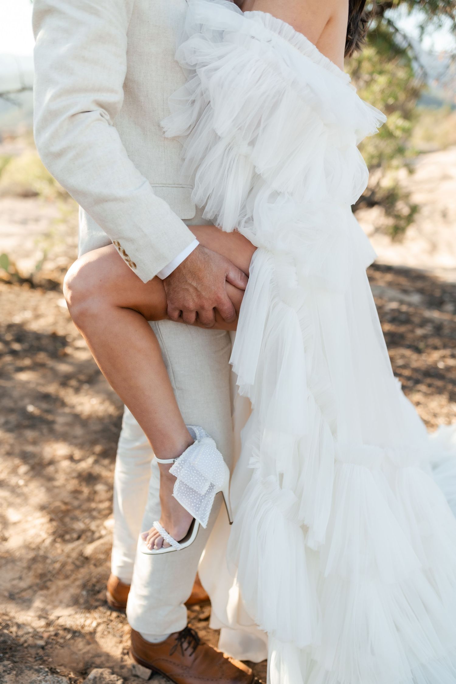 Zion destination photographer, Close-up details of wedding attire against desert backdrop. Utah Zion Photographer.