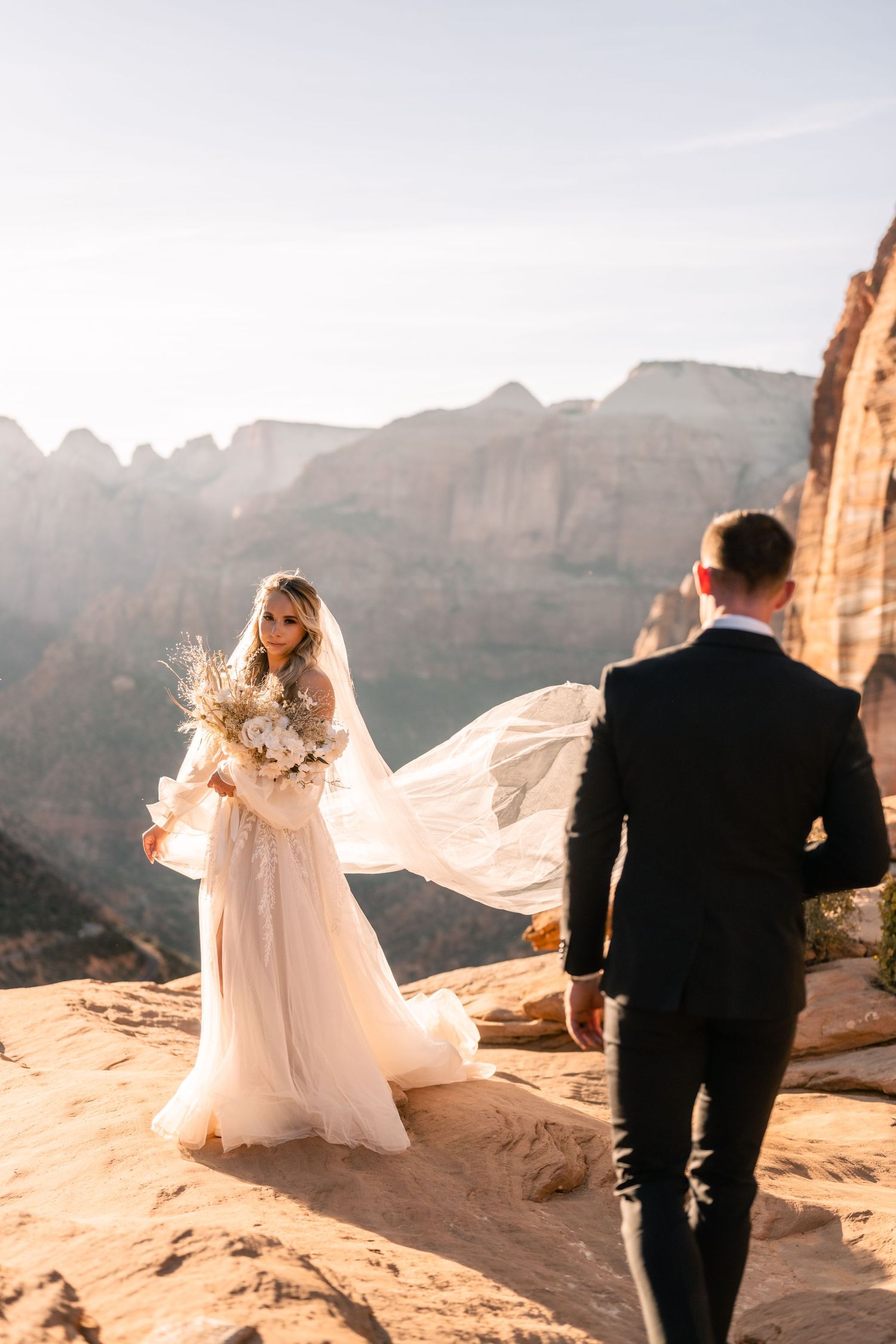 Wedding portraits at the Zion Overlook at sunset by Utah Elopement Photographer