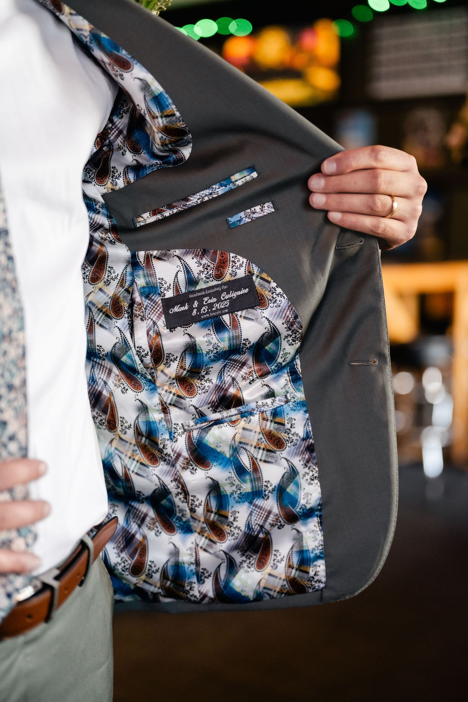 Close-up of suit jacket lining customized with printed photographs.