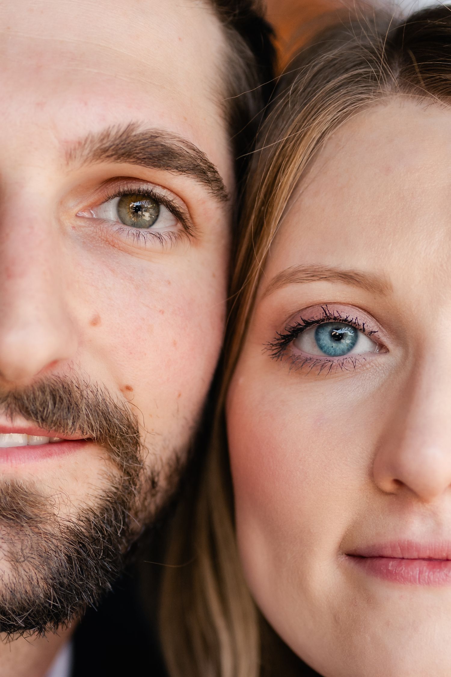 A close-up artistic portrait showing two different colored eyes side by side.