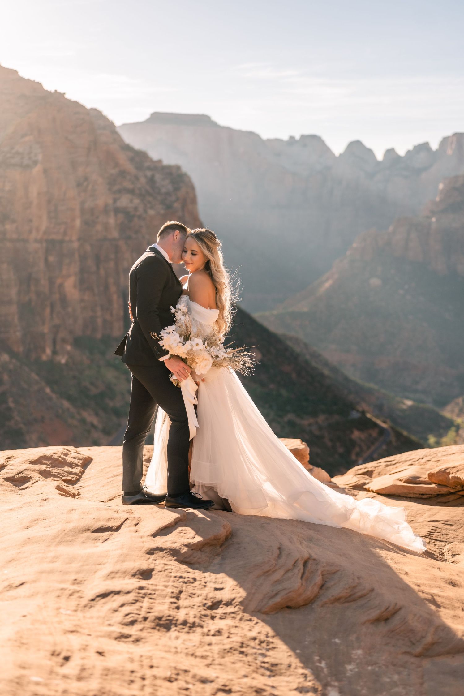 Wedding portraits at the Zion Overlook at sunset by Utah Elopement Photographer