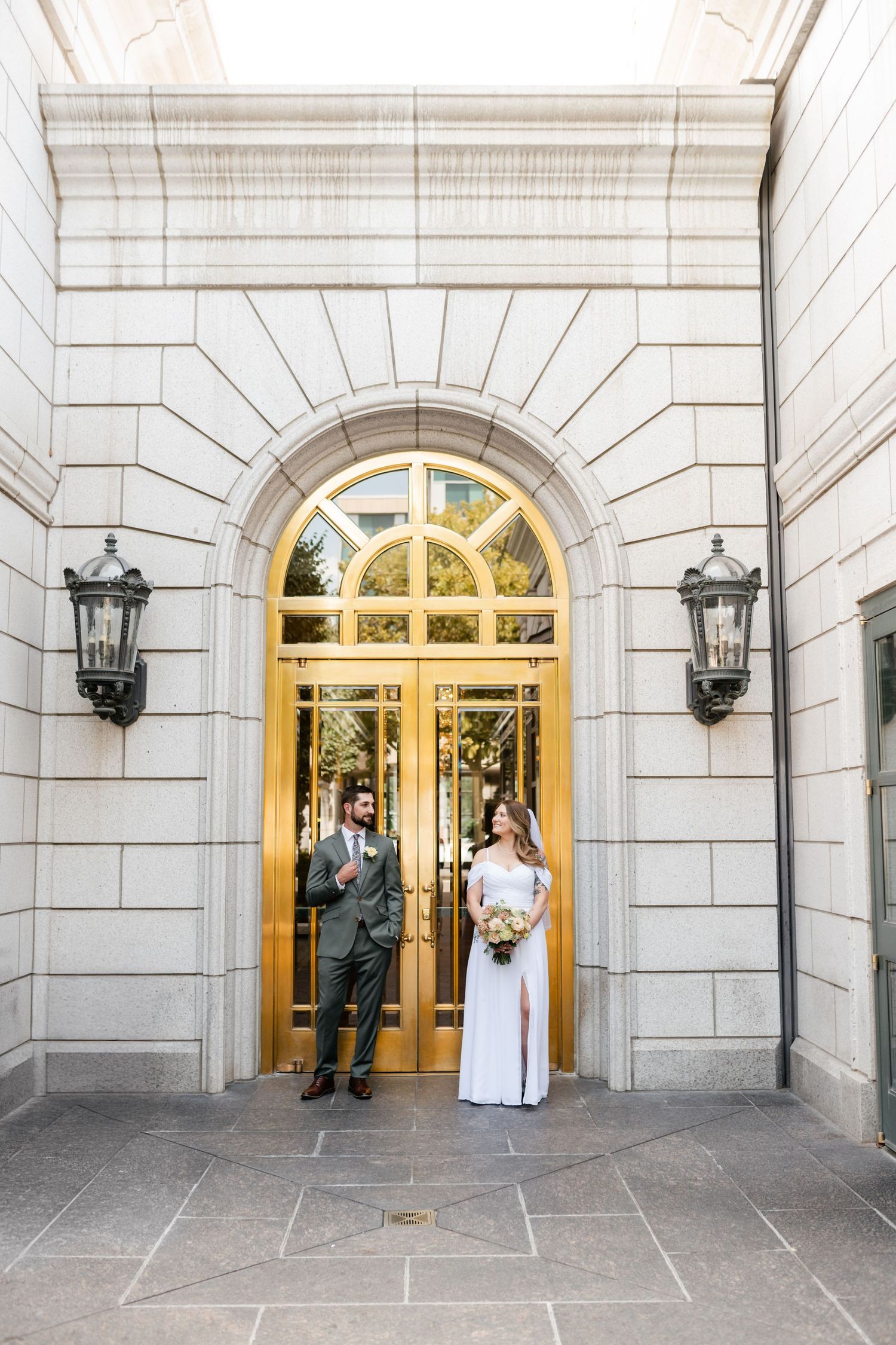 A series of wedding photos showing a couple in formal attire standing in an elegant arched doorway entrance.