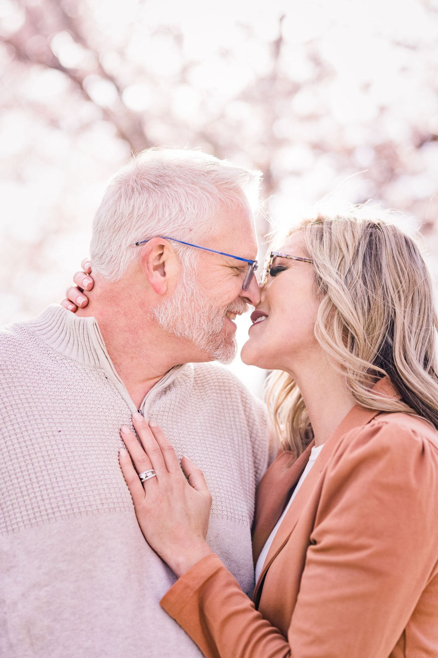 Romantic couple at the Capitol blossoms by Utah engagement photographer Coley Cook