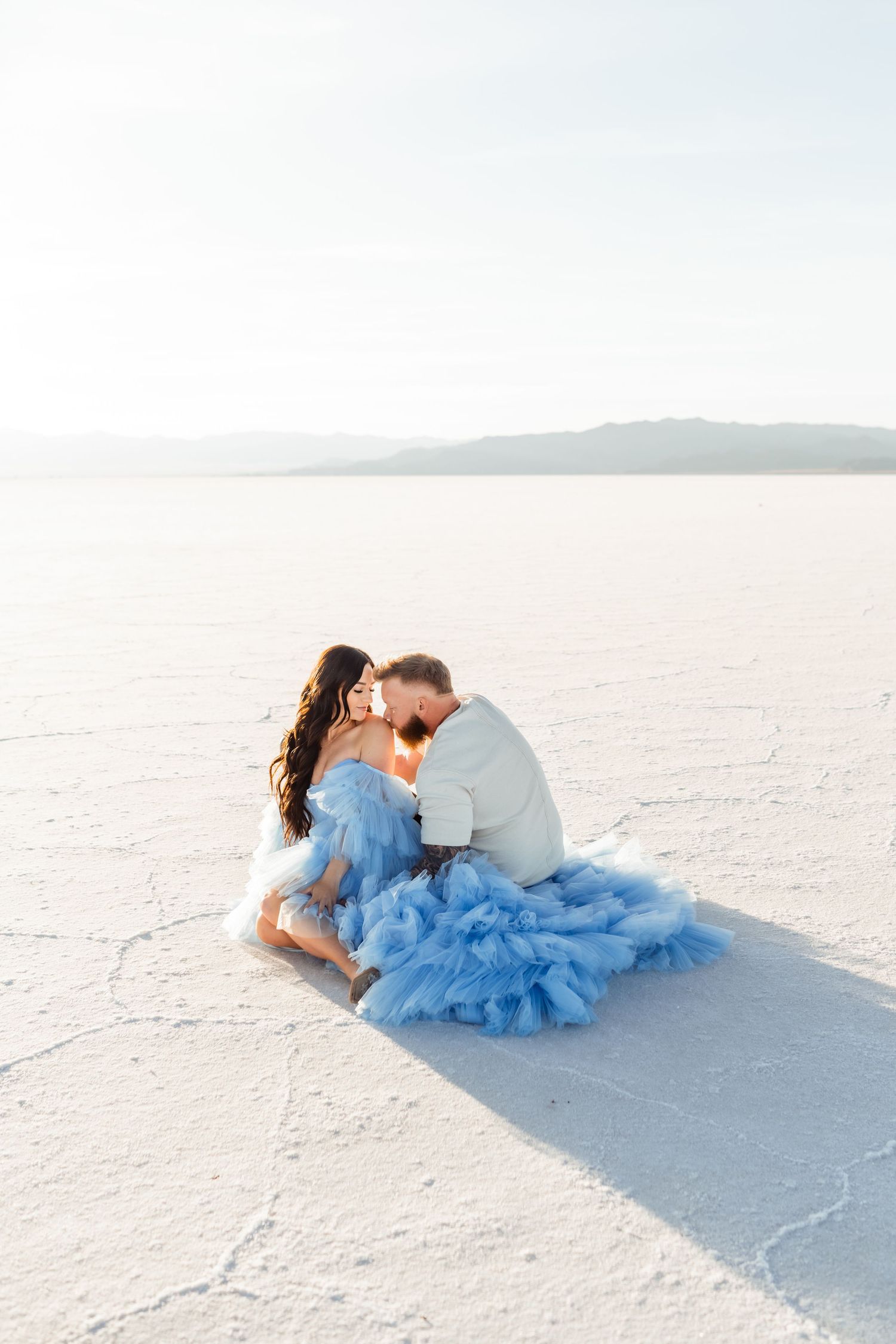 Salt Flats photos of a couple during sunset by Utah engagements photographer