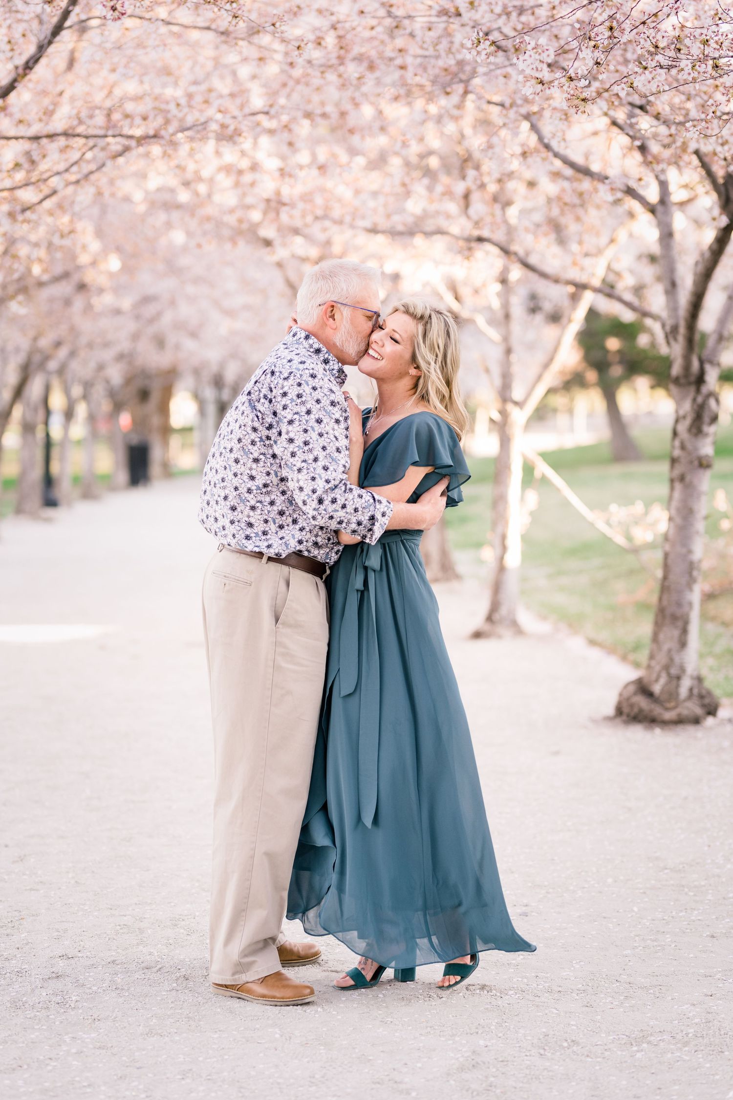 Engaged couple laugh and smile at the Utah State Capitol by Utah engagement photographer Coley Cook